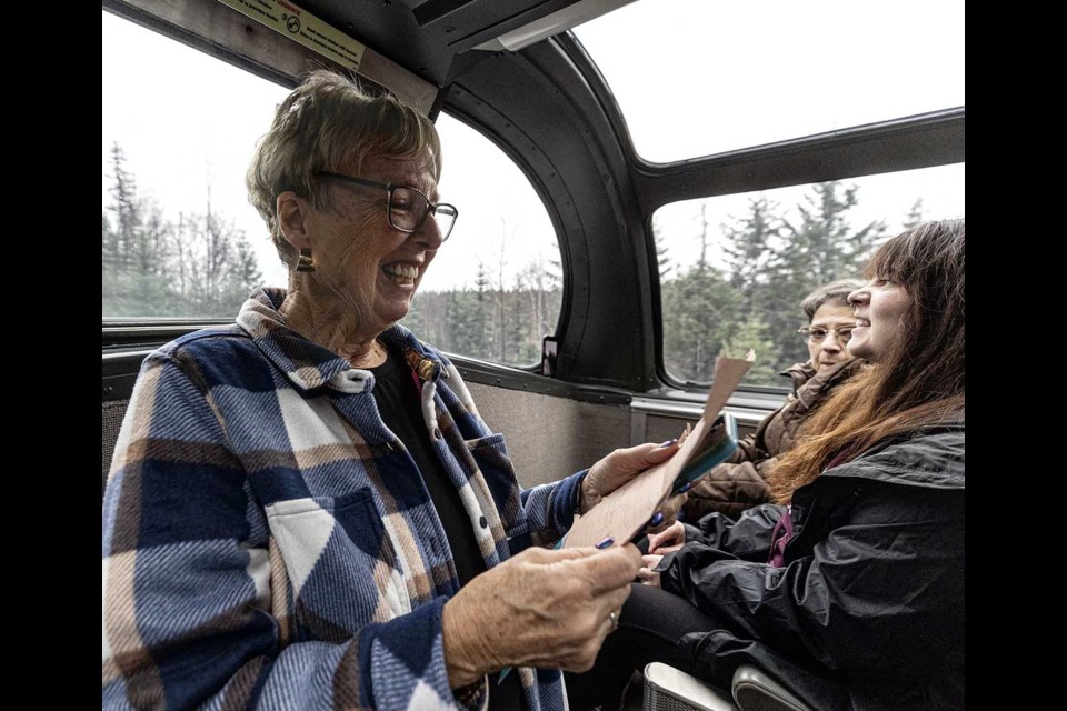 Linda Campbell, the Train Lady,  moves to the front of the Dome Car to tell everyone how things will work upon arrival at Dome Creek during the trip from Prince George.