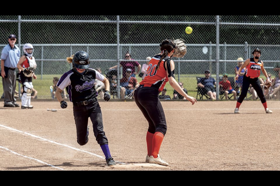 Prince George Panthers catcher Ava-May Rivard beats the throw to Penticton Power-Smith first base player Maddie Bystesveld Saturday during their game at Ron Wiley Stadium. The U15 Girls Fastball Provincials were held Friday through Sunday at Freeman Park and Ron Wiley Stadium.