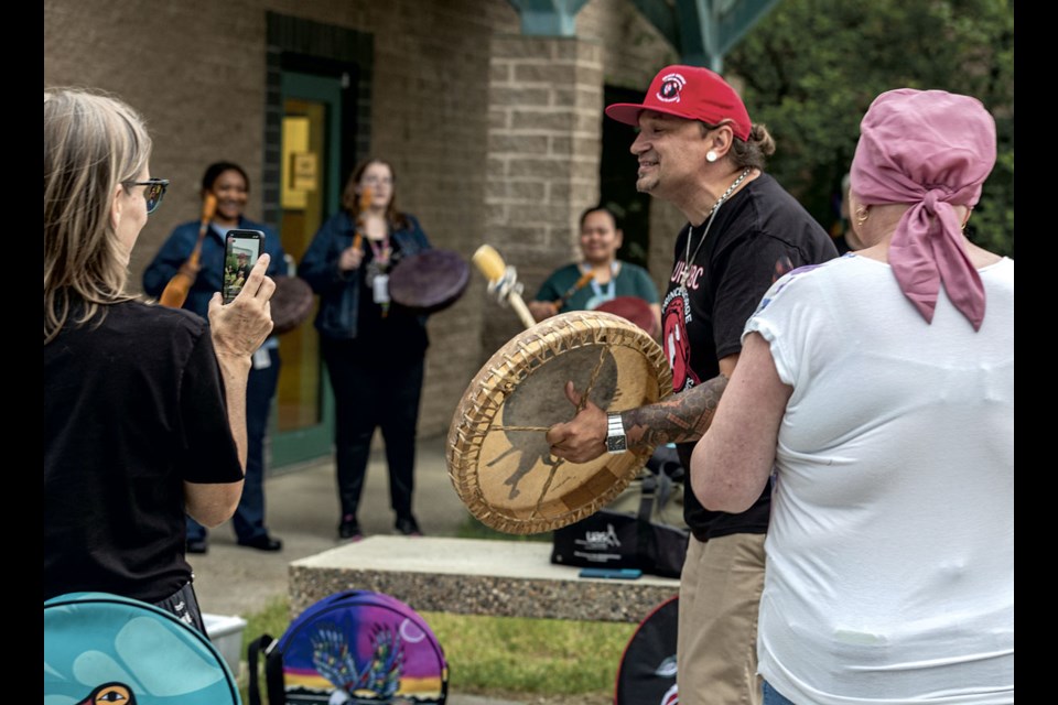 Wesley Mitchell of the UHNBC Drummers leads a drum song as four handmade drums built and presented to the Nechako Youth Treatment Centre by Roland Hillier are used by centre staff for the first time Monday evening at UHNBC. Hillier made four drums, two goat hide over a cedar frame and two bison hide over a cedar frame, for the Nechako Centre to use for cultural purposes.