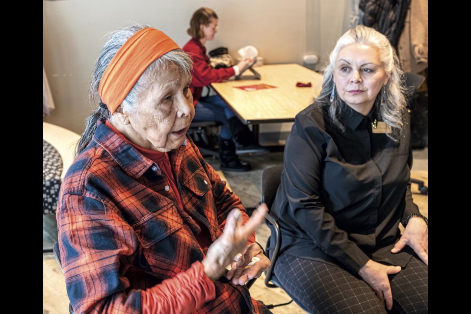 Elder Loretta Adams talks about how the Weaving Words Conference is about the stories (written, oral and in other mediums) that can convey the traditions and knowledge to youth while Lori Dansereau listens Thursday Feb. 27 in the UNBC First Nations Centre.