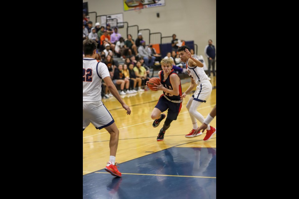 ALA Queen Creek senior point guard AJ Moss drives to the basket in the win over Poston Butte.