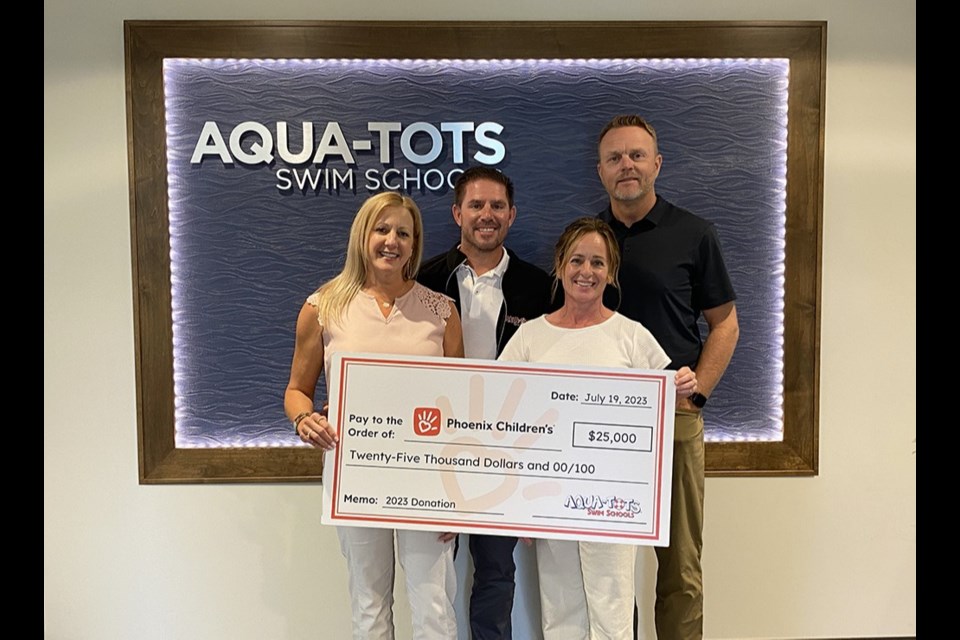 Aqua-Tots Swim Schools furthers its mission to save lives with a $25,000 donation to Phoenix Children’s. From left are Jane Sciarro, Ron Sciarro, Heather Preston and Paul Preston.