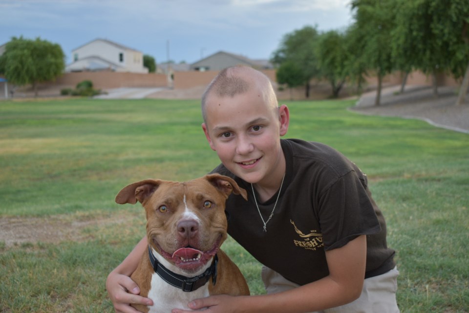 Braydon Felix and his dog, a Pitbull named Bailey, live in Queen Creek.