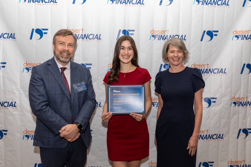 Desert Financial Foundation's Tom Marlowe, left, and Cathy Graham, right, presented resident Elizabeth Porten, center, a $3,000 Community Service Scholarship. Porten, who recently graduated from Casteel High School in Queen Creek, plans to study art at Grand Canyon University this fall.