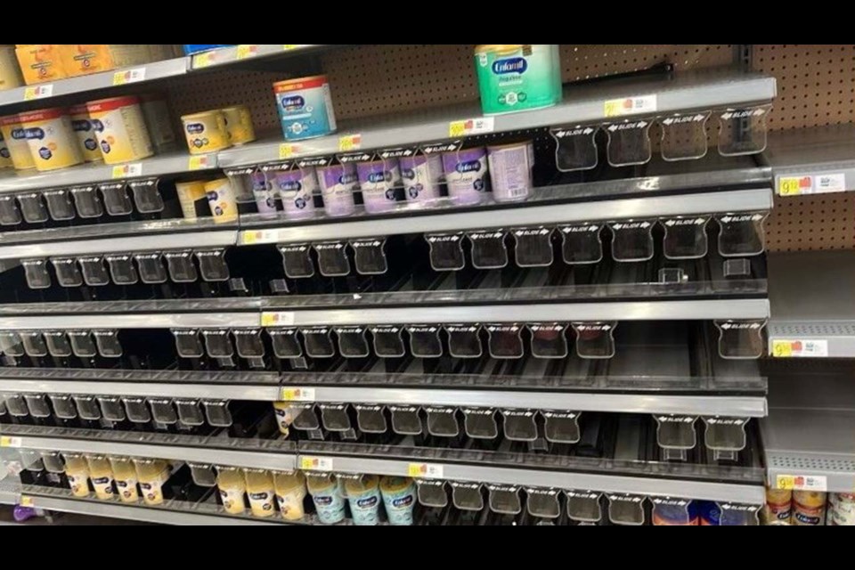 Empty store shelves where supplies of certain infant formulas are scarce.