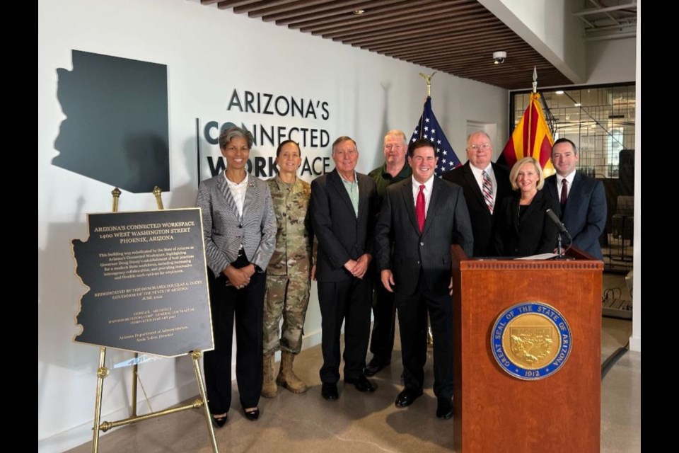 Gov. Doug Ducey celebrates the dedication of Arizona's Connected Workspace with directors of state agencies. From left: Col. Wanda Wright, Maj. Gen. Kerry Muehlenbeck, Tom Buschatzke, Allen Clark, the governor, Andy Tobin, Jami Snyder and Louis Dettorre.