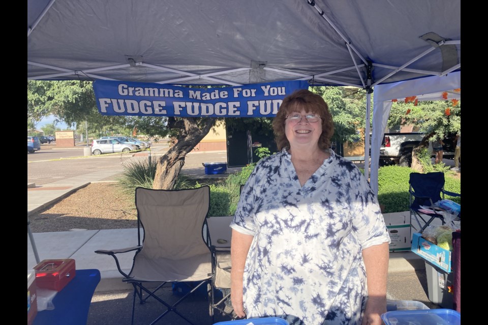 San Tan Valley resident Laura Ouellette stands in front of her booth at the San Tan Valley Farmers Market & Bazaar last month.