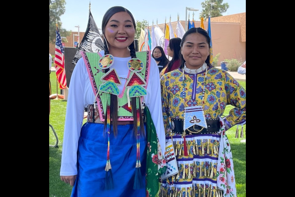 Native American students at Mesa Community College in traditional colorful clothing.