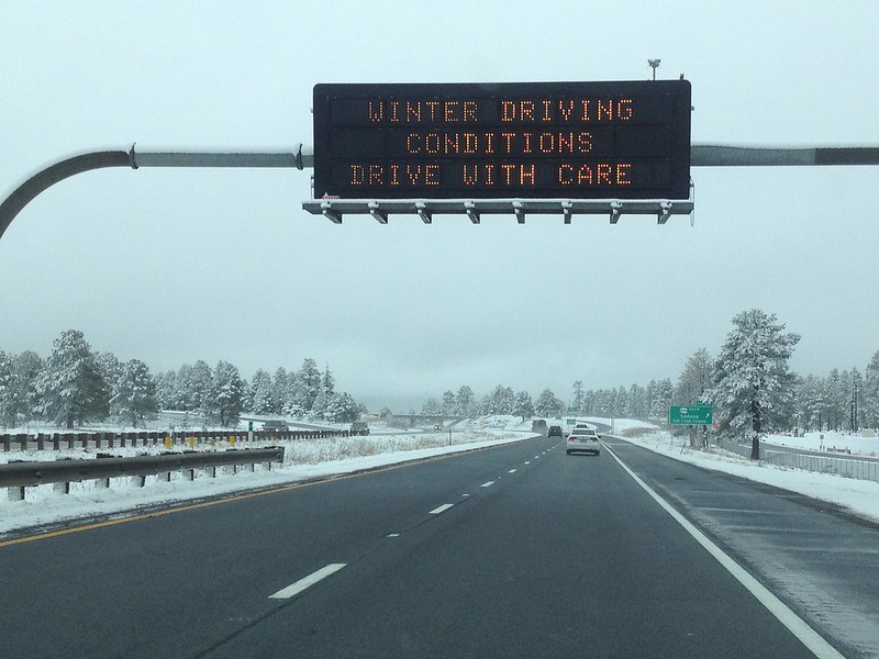 The Arizona Department of Transportation is warning motorists who are hitting the road during the long Christmas weekend to use extra caution as a winter storm delivers wet roads across Arizona and light snowfall at higher elevations.