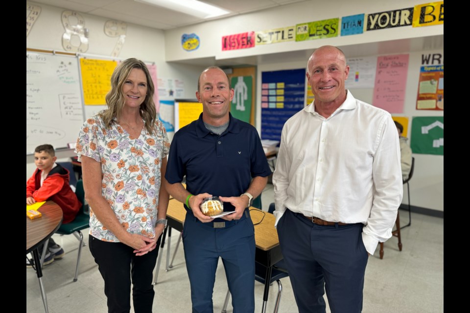 Superintendent Dr. Perry Berry, right, with Award of Excellence nominee Jeff Sutter, middle, and Queen Creek Elementary Principal Dawn Michaelson, left.