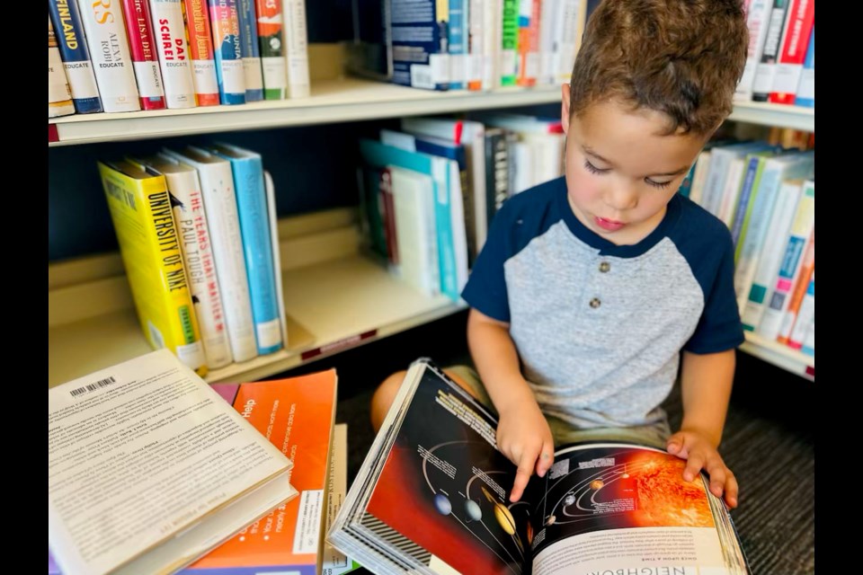 James Rescan, who turned 4 in May 2024, working with his tutor. During the last decade, he's one of the two youngest individuals from Queen Creek to be accepted into American Mensa.