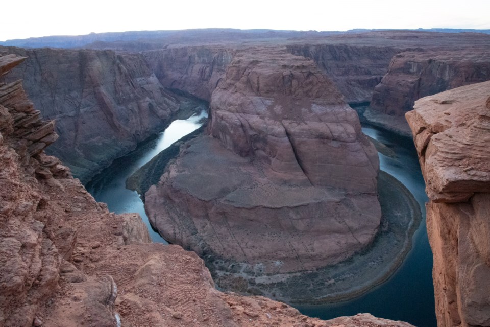 The sun setting over Horseshoe Bend.