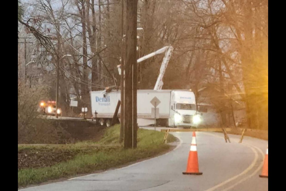 A semi truck seen having crashed into a pole and blocking a portion of River Road near No. 7 Road.