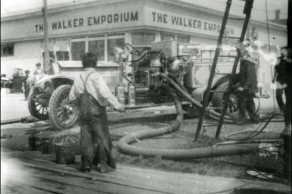 Firemen and equipment outside Walker Emporium during the Steveston fire.