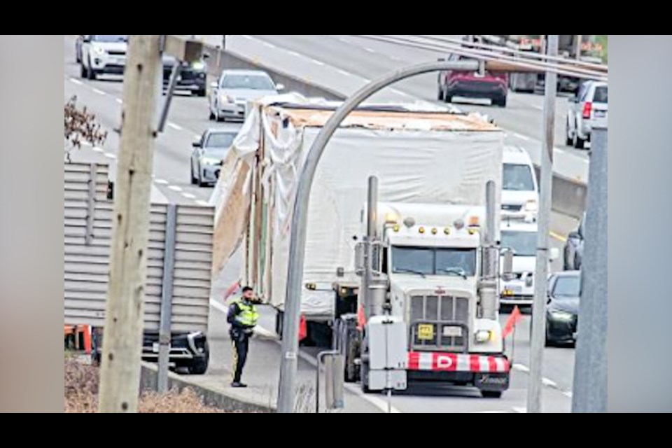 A pre-fabricated home loaded onto a tractor-trailer hit the Blundell overpass in Richmond on Wednesday morning.