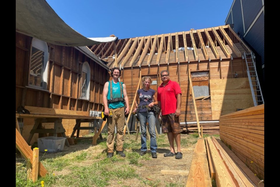 Karson Leigh and Amber Fouts with Extraordinary League (left and middle) at the thrift store worksite with store manager Rajan Paul.