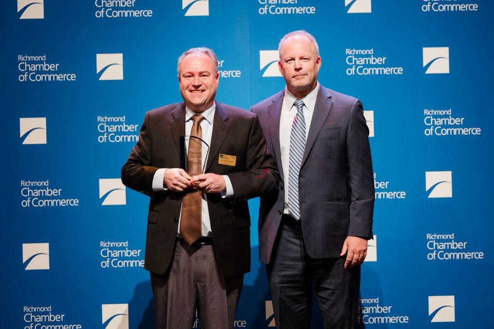 ltor-phillip-potts-accepts-the-award-for-small-business-of-the-year-presented-by-bill-sherritt-from-vancity