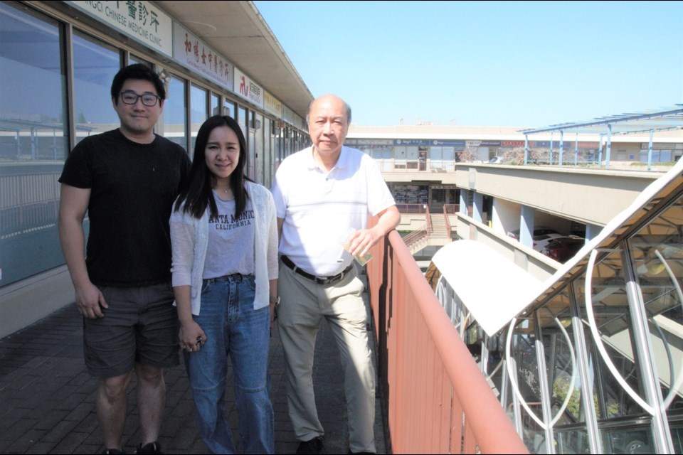 Edwin Tsang (right) and Kenneth Ho (left) from Pacific Plaza’s strata council and Vivian Man, assistant mall supervisor are working with other business owners to revitalize the 25-year-old mall. Daisy Xiong photo 