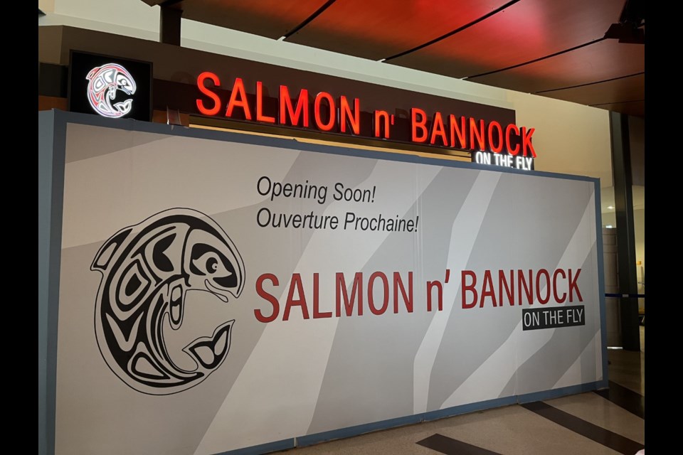 Salmon n' Bannock On The Fly is located next to Starbucks in International Departures after security. 