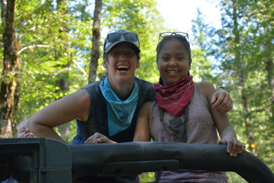 Richmond firefighter Erin Moore-Dempsey (left) with one of her friends at Burn Camp