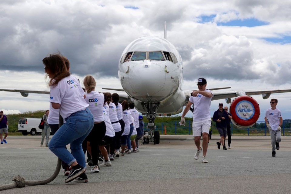 Community members gathered at FedEx's ramp at YVR on Sunday for an annual tug-of-war fundraiser benefitting Orbis Canada.