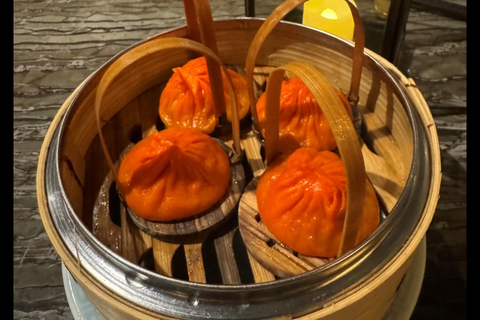 When visiting Mott 32, Tony recommend trying their hot & sour Iberico pork Shanghainese soup dumplings