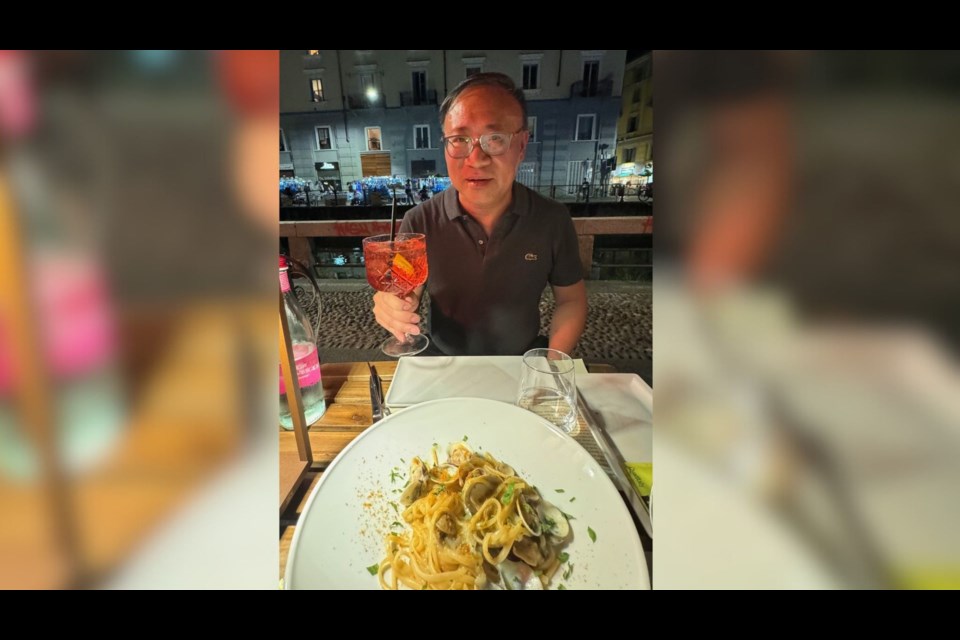 Wine columnist Tony Kwan enjoying a Campari Spritz in the Navigli district of Milan.