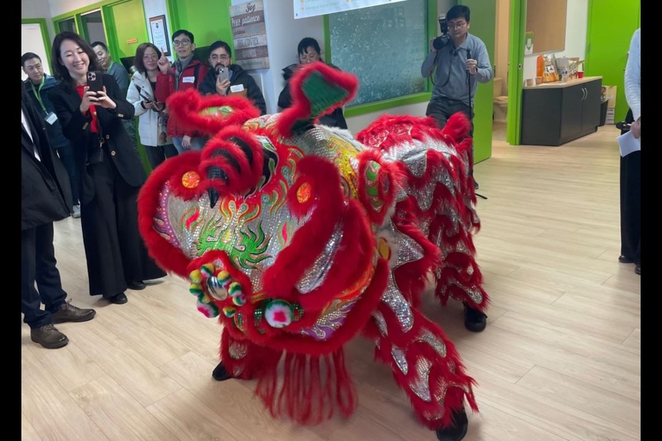 A lion dance was part of the opening ceremony for the new location of Connections Community Services.