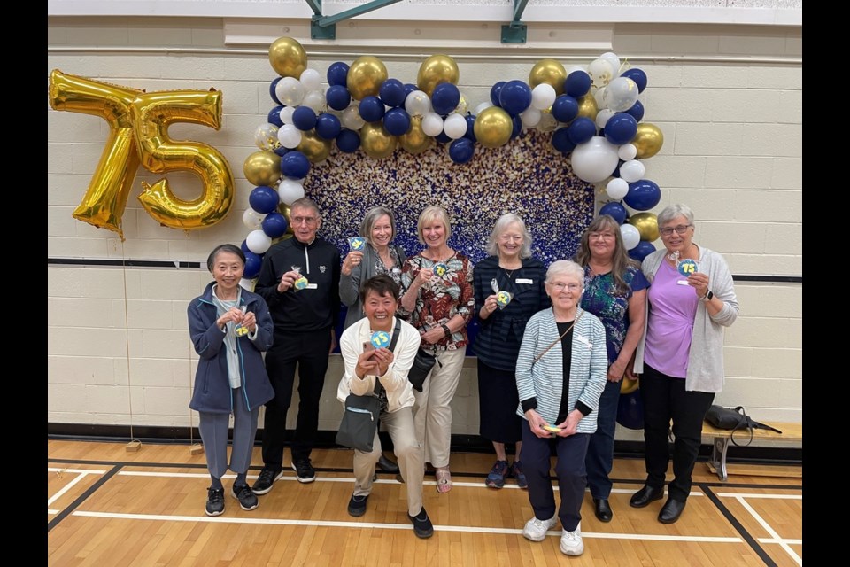 Garden City elementary staff from ’70s to ’80s reunited. Loraine Martin (right in front row) is one of many retired Richmond teachers who volunteer at General Currie School's Heritage Museum curating historic items from Richmond schools.