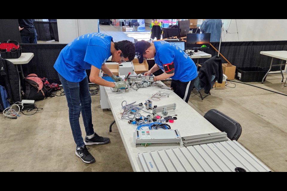 Nguyen Cao An (Ryan) Do (right) and Jorge Lorenzana Lopez during the 2024 Skills Canada British Columbia Provincial Competition.