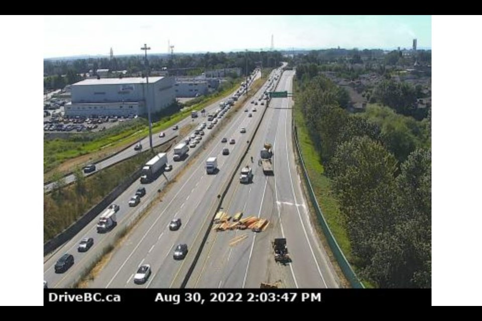 A portion of Highway 91 is blocked due to lumber falling off a truck.