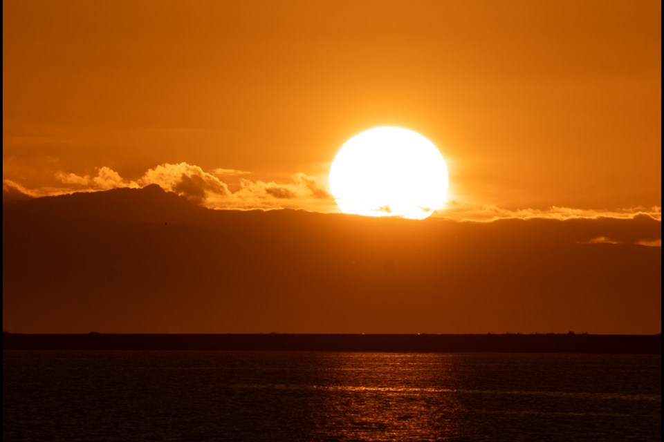 Setting sun at Iona Beach Regional Park.