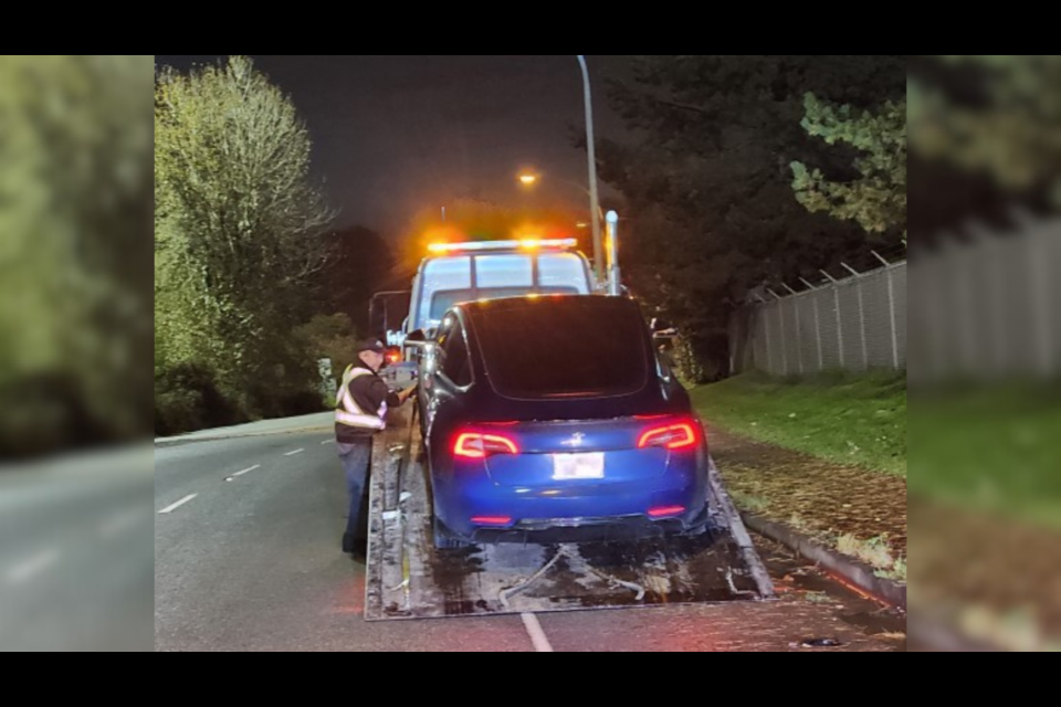 A blue Tesla was towed on Oct. 20 after travelling at 143 km/h in a 90 km/h zone on Hwy 91.