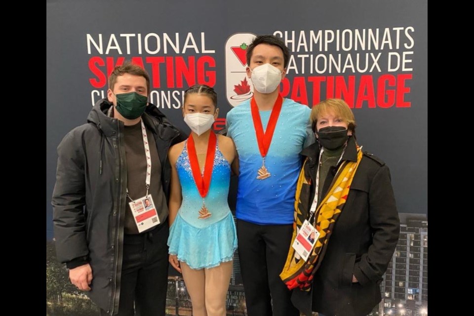 Richmond figure skating pair Jessie Sun and Victor Lum (centre) with their Connaught coaches  Jacob Cryderman and Eileen Murphy. 
