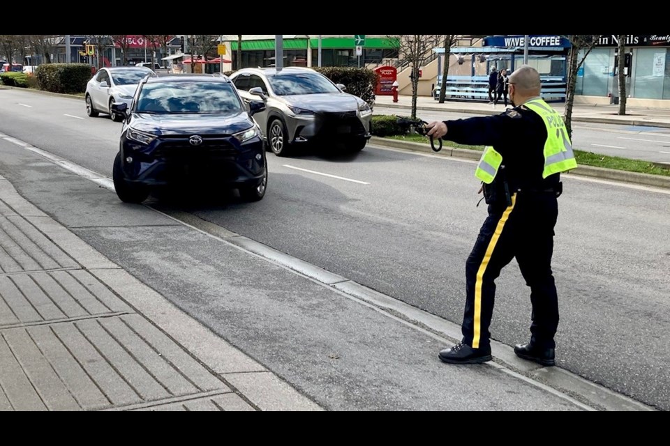 Richmond Mounties were pulling over vehicles in the city centre today for using their phones while driving