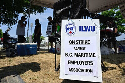 Port workers rally outside BCMEA Waterfront Training Centre on Richmond's Mitchell Island. Photo: Galileo Cheng 