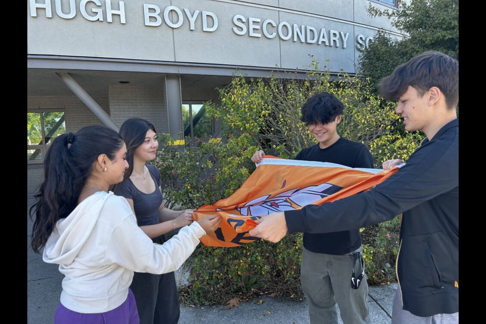 Students at Hugh Boyd secondary raised money to buy 50 “Every Child Matters” flags for all schools in the Richmond School District. Michael Taylor photo 