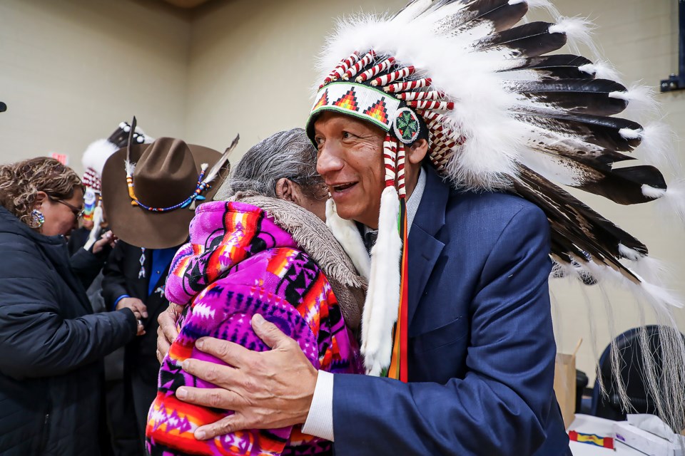 Bearspaw First Nation Chief Darcy Dixon greets an elder during the inauguration of the First Nation's chief and council at the Bearspaw Youth Center in Mînî Thnî in December 2022. 

JUNGMIN HAM RMO FILE PHOTO