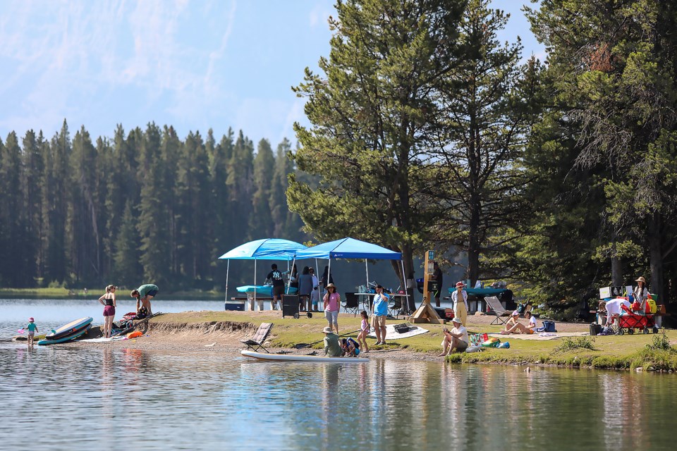 Crowds of visitors cool down in Two Jack Lake in Banff National Park. JUNGMIN HAM RMO PHOTO