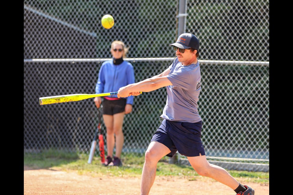 Brad Toma looks to drive in some runs against the Little Italy Mafia during a mini slo-pitch tournament at the Exshaw recreational grounds in August 2023. JUNGMIN HAM RMO  FILE PHOTO