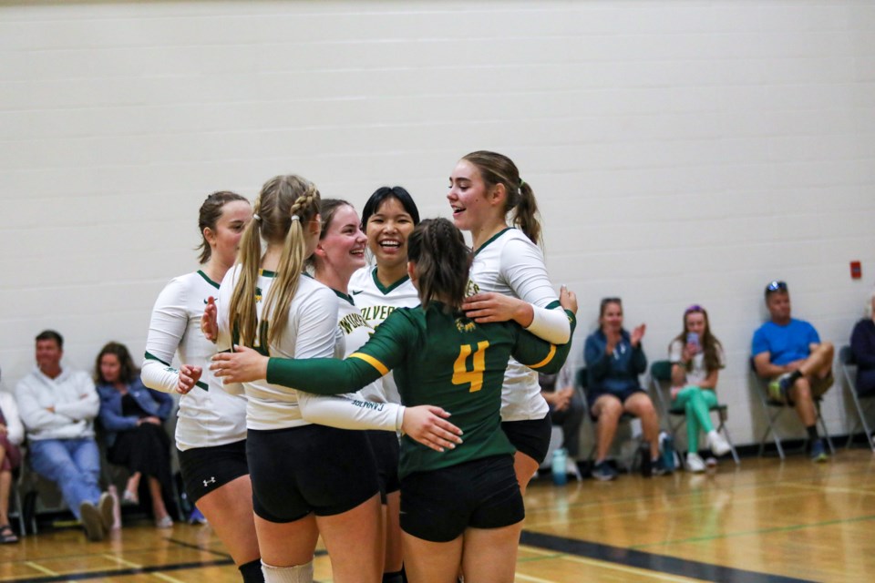 The Canmore Wolverines senior girls volleyball team celebrate after scoring against the Bow Valley High School during the senior girls exhibition tournament at Canmore Collegiate High School in September 2023. JUNGMIN HAM RMO PHOTO  