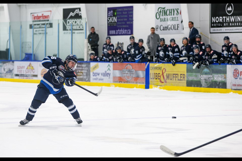 Canmore Eagles defenceman Casey Black blasts one on net against the Drumheller Dragons at the Canmore Recreation Centre on Friday (Dec. 15). The Eagles beat the Dragons 5-0. JUNGMIN HAM RMO PHOTO  