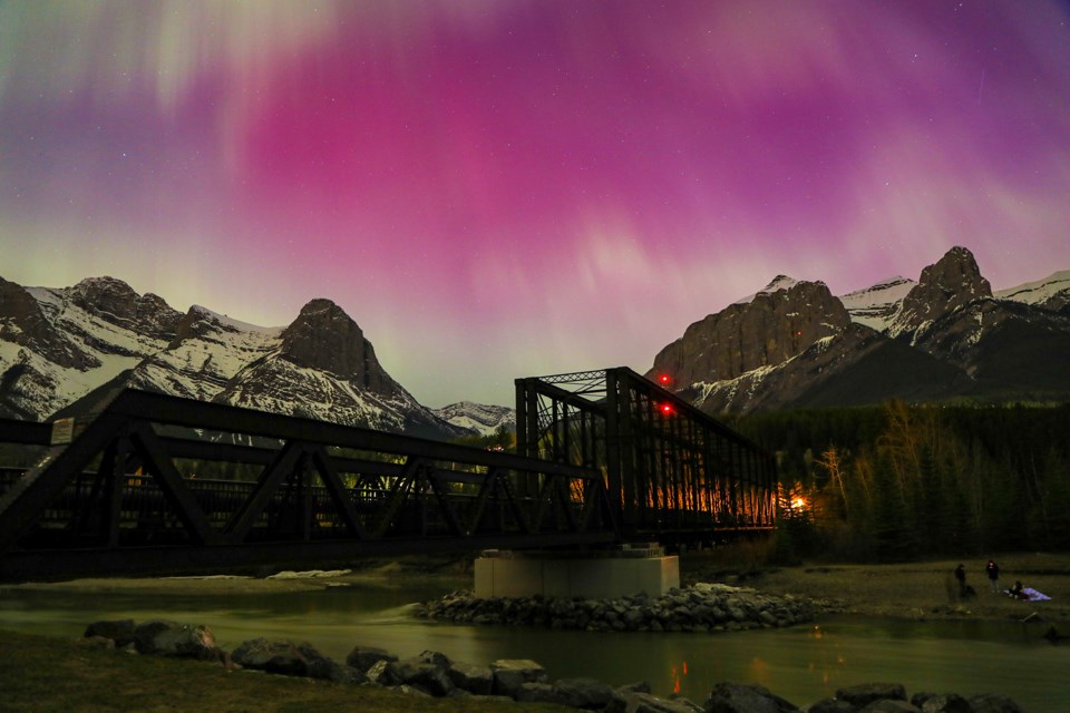The Canmore Engine Bridge was highlighted by the northern lights in Canmore on Saturday (May 11). JUNGMIN HAM RMO PHOTO
