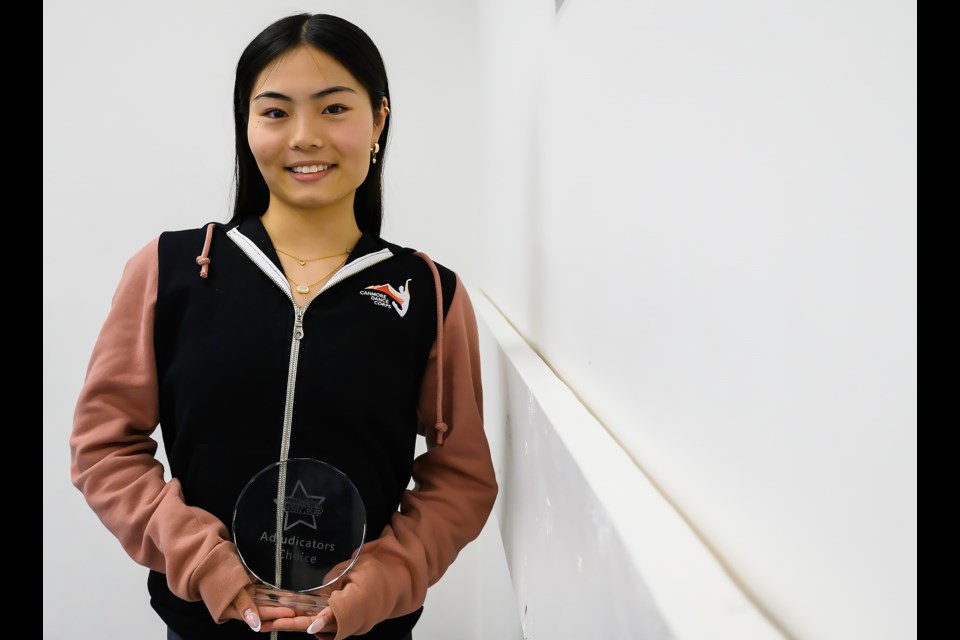 Tsukino Mori of Canmore Dance Corps poses for a photo holding the "Wanna Dance?" adjudicators choice award in Canmore at their studio on Tuesday (May 14). MATTHEW THOMPSON RMO PHOTO
