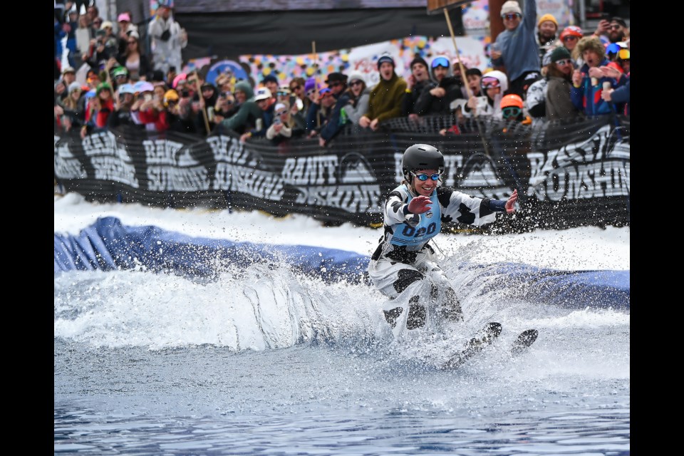 Annie Jackett smiles while trying to make it across the water at Banff Sunshine Village's Slush Cup on Monday (May 20). MATTHEW THOMPSON RMO PHOTO