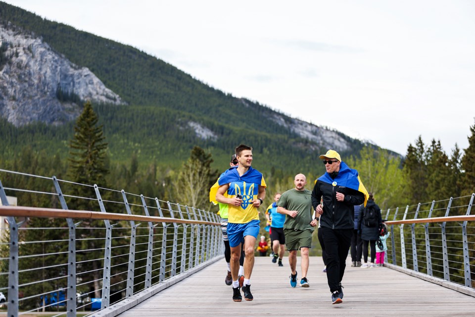 Participants run in the first Unity Run for Ukraine on Nancy Pauw Bridge in Banff on Saturday (June 1). The event is to raise awareness about the war in Ukraine and raise funds for the Armed Forces of Ukraine. JUNGMIN HAM RMO PHOTO 