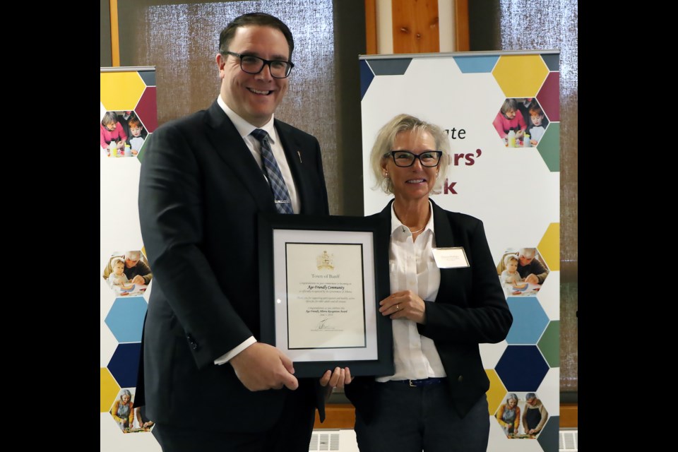 Alberta’s Minister of Seniors, Community and Social Services Jason Nixon, left, recognizes Banff resident Sharon Phillips, chair of Age-Friendly Banff on Monday (June 3) at the start of seniors’ week, which runs June 3-9. The Town of Banff was recognized as an age-friendly community by the Alberta government. GREG COLGAN RMO PHOTO