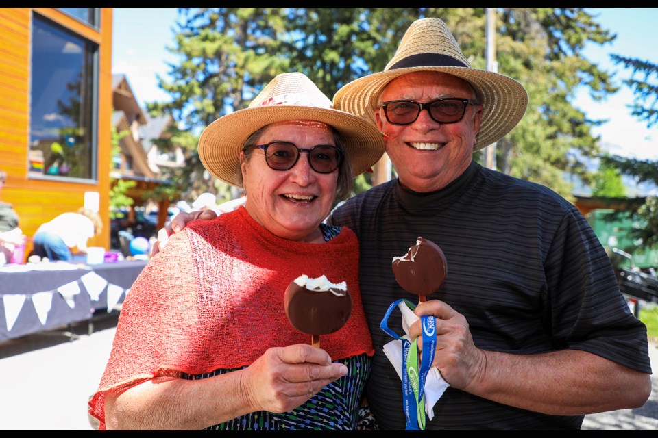 Marilyne Kissel, left, and Barry Kissel enjoy ice cream bars at the seniors' ice cream social and resource fair at the Canmore Civic Centre and Rotary Friendship Park on Thursday (June 6). JUNGMIN HAM RMO PHOTO