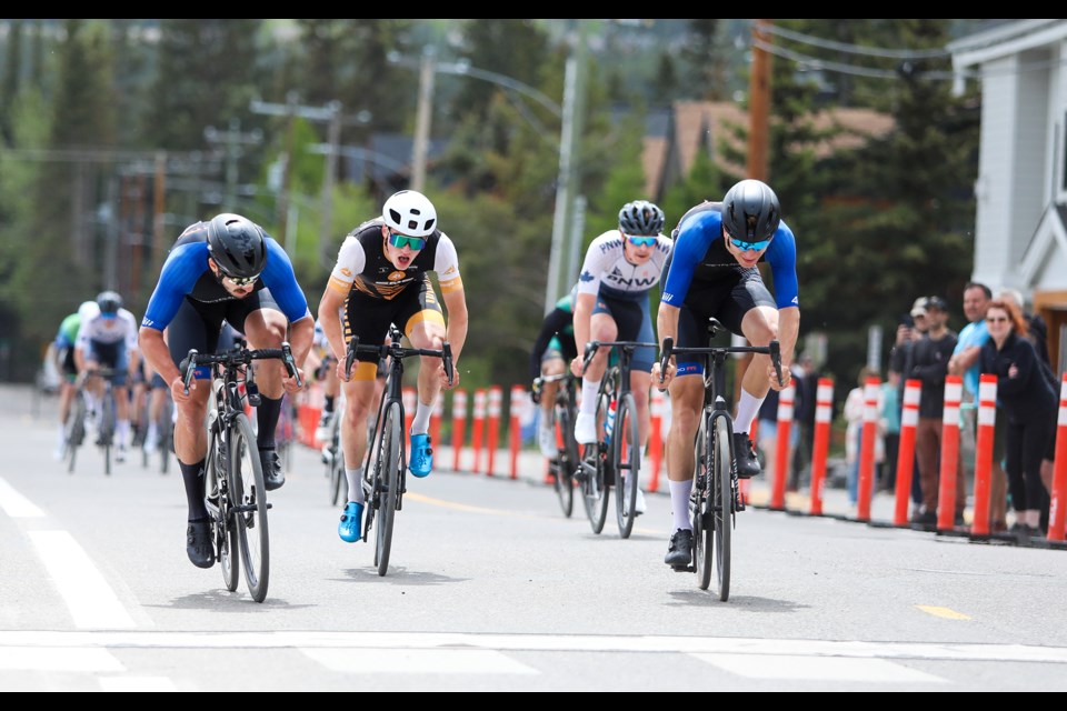 It's a photo finish between Gavin Broadhead, left, and Connor Howe at the finish line for first place and second place in the men's CAT 1/2 crit at the Rundle Mountain Road Festival in Canmore on Saturday (June 8). JUNGMIN HAM RMO PHOTO