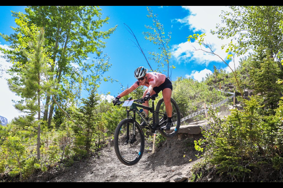 Sydney Nielson rushes down a steep trail during the 2024 Canmore Canada Cup XCO at the Canmore Nordic Centre on Wednesday (June 12). JUNGMIN HAM RMO PHOTO 